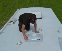 Man repairing RV roof