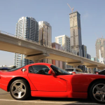 Sports car traveling on a modern roadway in Dubai