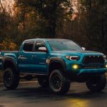 Lift kit failure causing a truck rollover at an off-road trail event