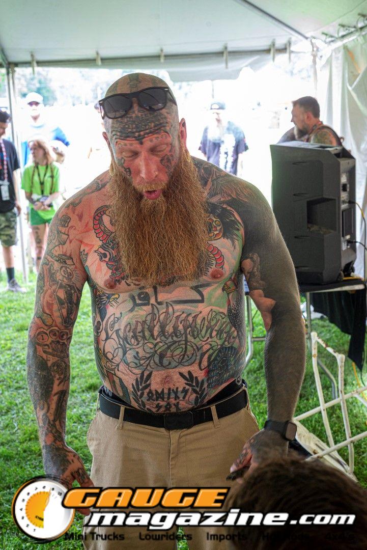 Contestants showing tattoo artwork during the Slamology 2026 Tattoo Contest on the Orion Car Audio Stage