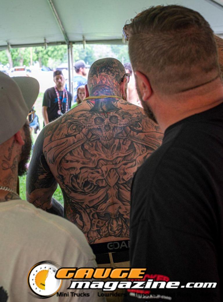 Contestants showing tattoo artwork during the Slamology 2026 Tattoo Contest on the Orion Car Audio Stage