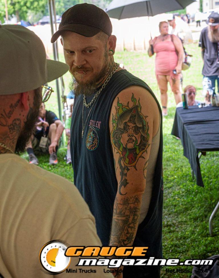Contestants showing tattoo artwork during the Slamology 2026 Tattoo Contest on the Orion Car Audio Stage