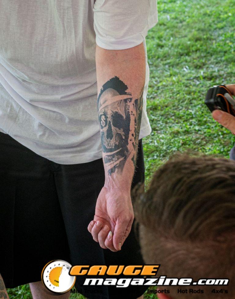 Contestants showing tattoo artwork during the Slamology 2026 Tattoo Contest on the Orion Car Audio Stage