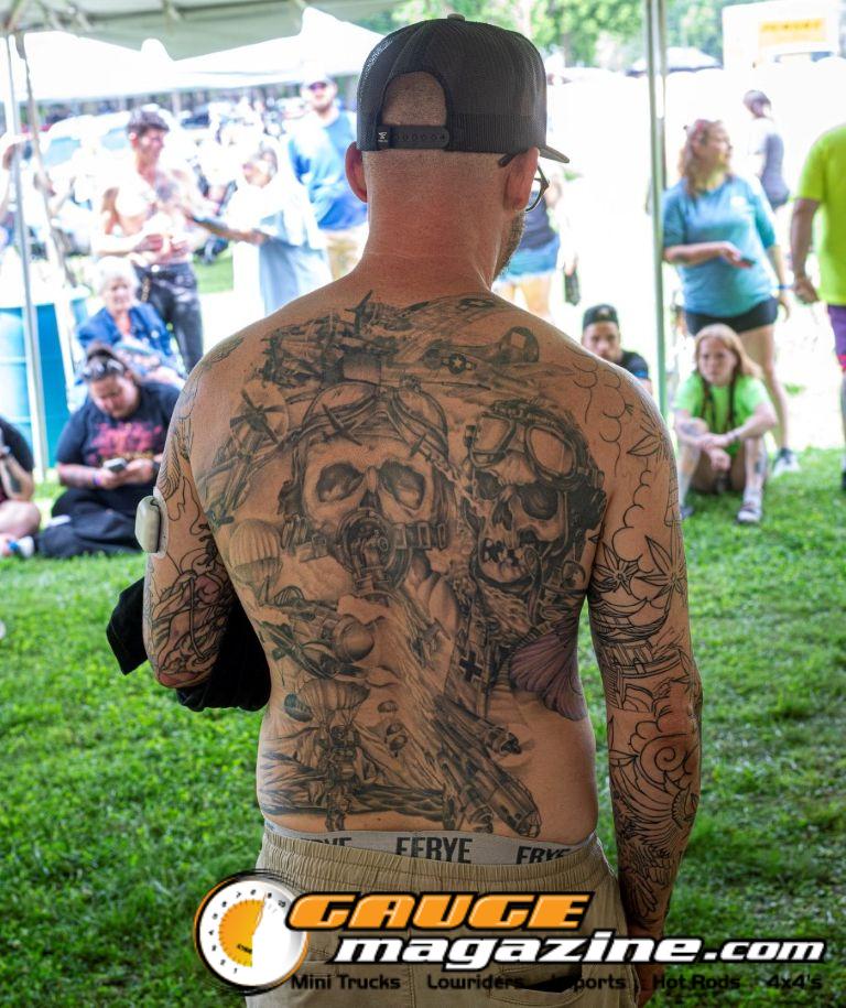 Contestants showing tattoo artwork during the Slamology 2026 Tattoo Contest on the Orion Car Audio Stage