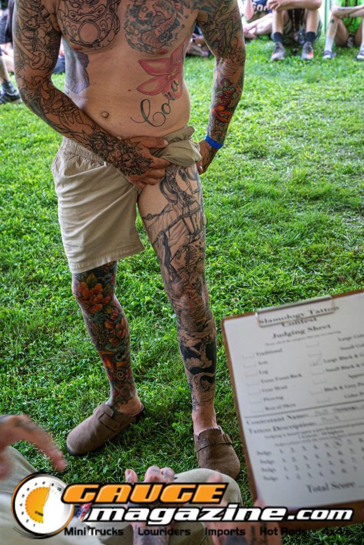 Contestants showing tattoo artwork during the Slamology 2026 Tattoo Contest on the Orion Car Audio Stage