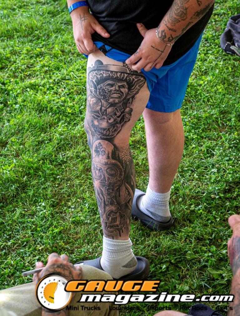 Contestants showing tattoo artwork during the Slamology 2026 Tattoo Contest on the Orion Car Audio Stage