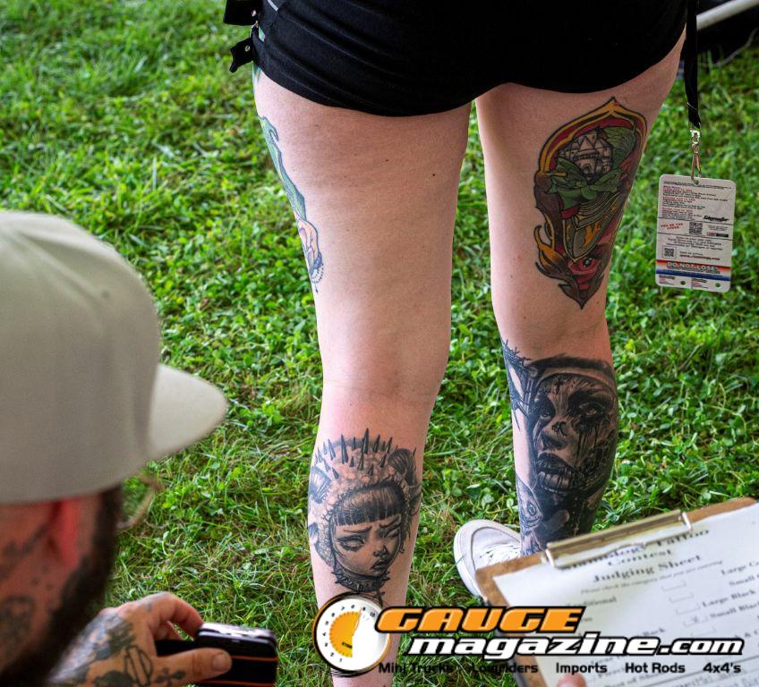 Contestants showing tattoo artwork during the Slamology 2026 Tattoo Contest on the Orion Car Audio Stage