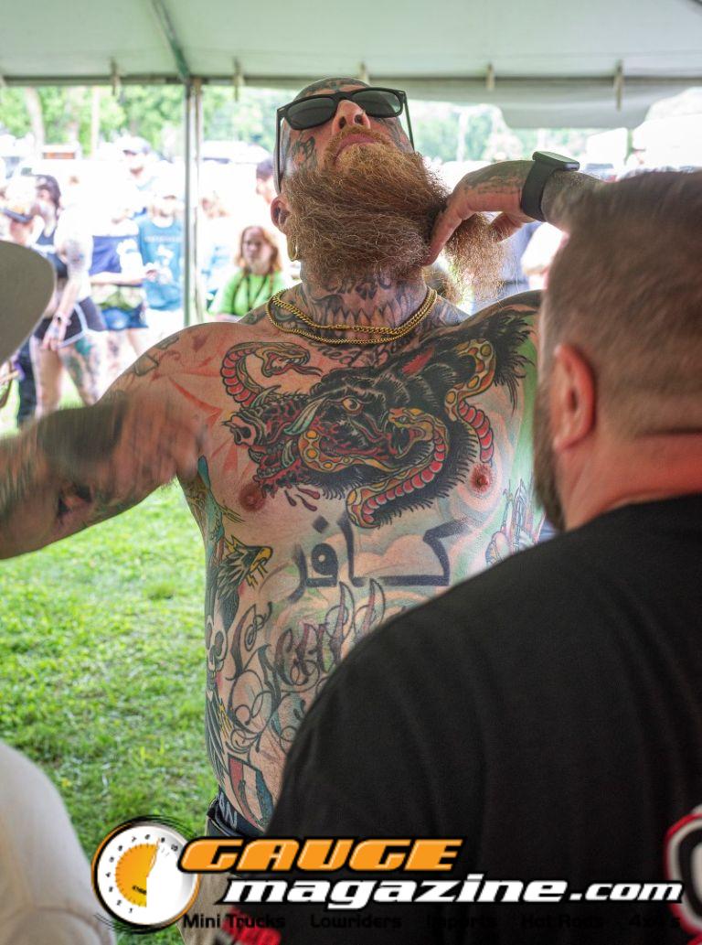 Contestants showing tattoo artwork during the Slamology 2026 Tattoo Contest on the Orion Car Audio Stage