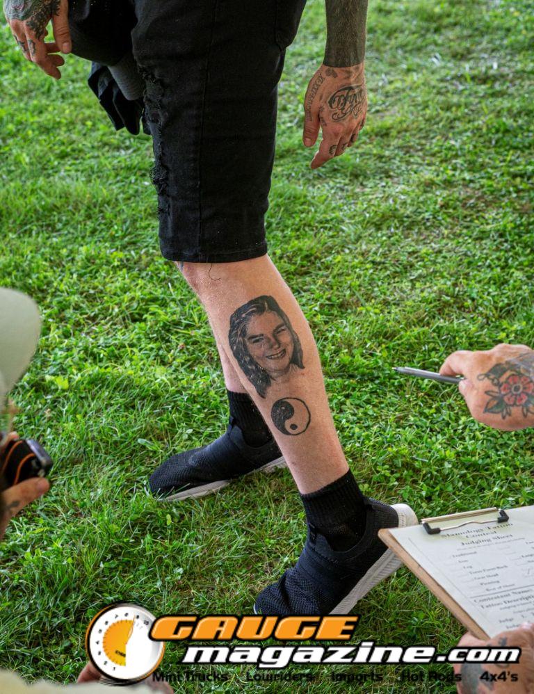 Contestants showing tattoo artwork during the Slamology 2026 Tattoo Contest on the Orion Car Audio Stage
