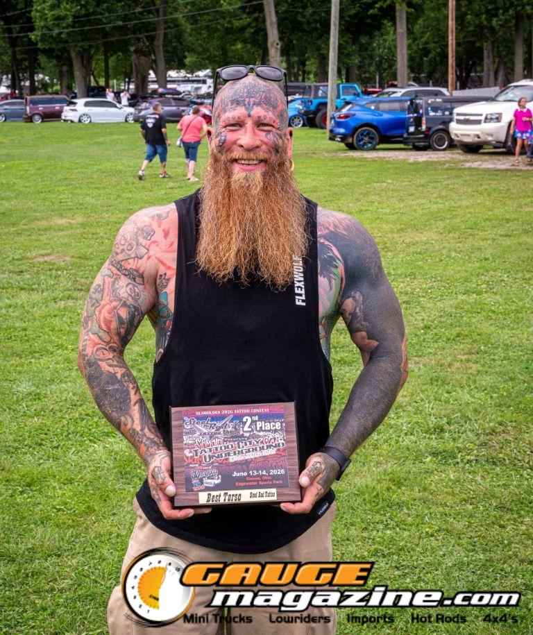 Contestants showing tattoo artwork during the Slamology 2026 Tattoo Contest on the Orion Car Audio Stage