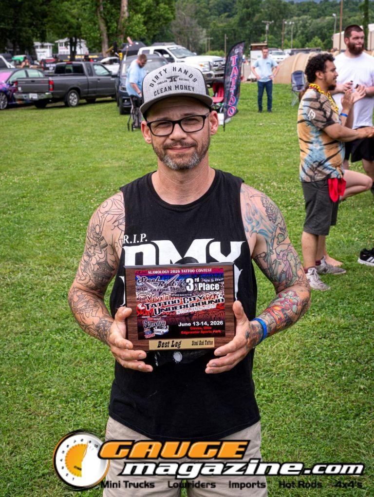 Contestants showing tattoo artwork during the Slamology 2026 Tattoo Contest on the Orion Car Audio Stage