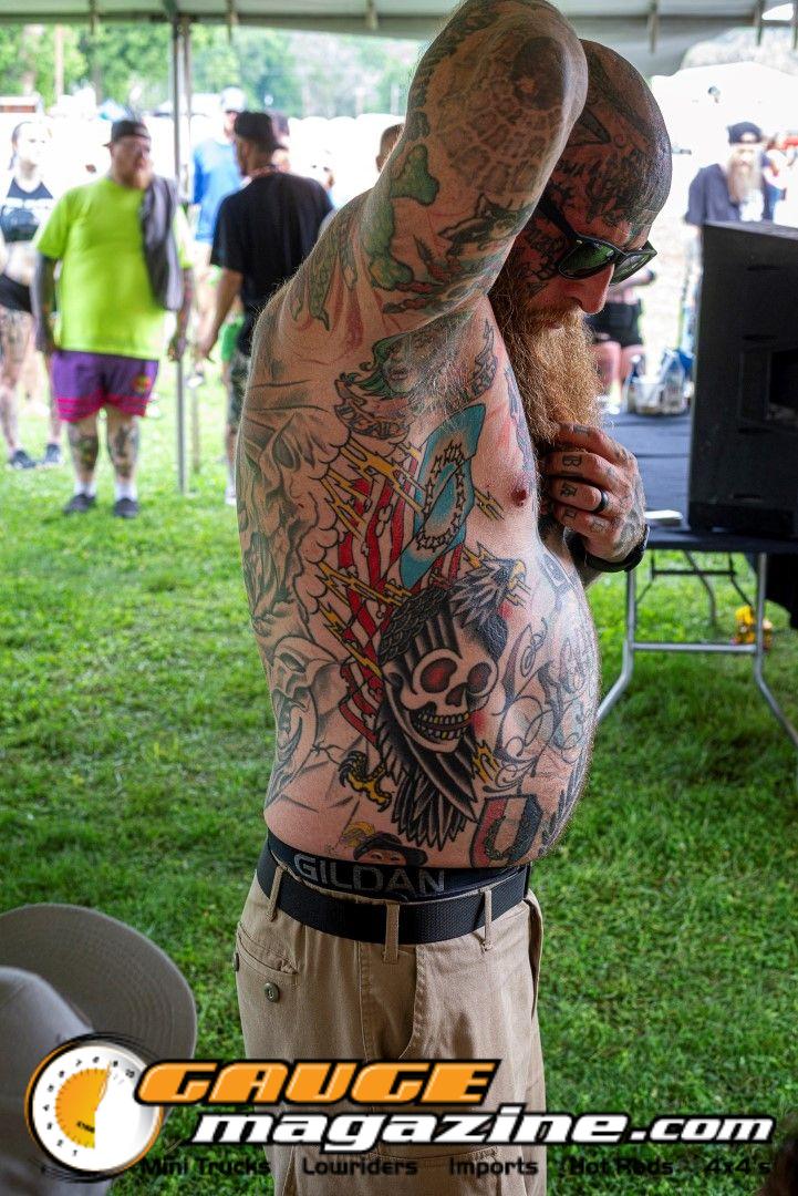 Contestants showing tattoo artwork during the Slamology 2026 Tattoo Contest on the Orion Car Audio Stage