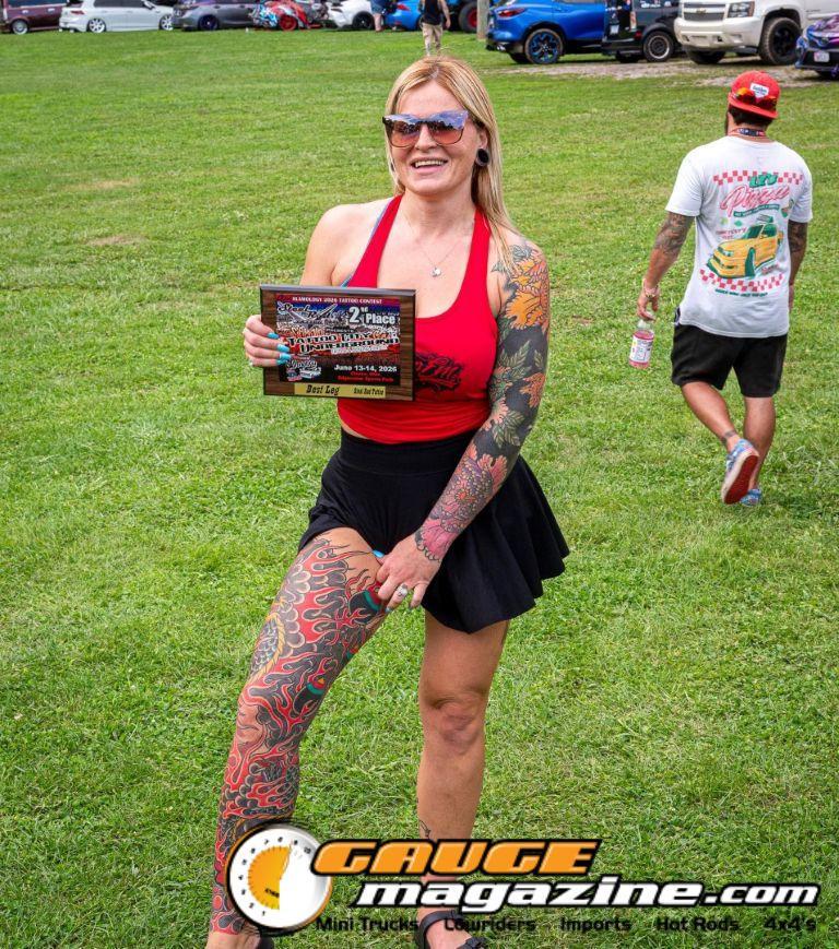 Contestants showing tattoo artwork during the Slamology 2026 Tattoo Contest on the Orion Car Audio Stage