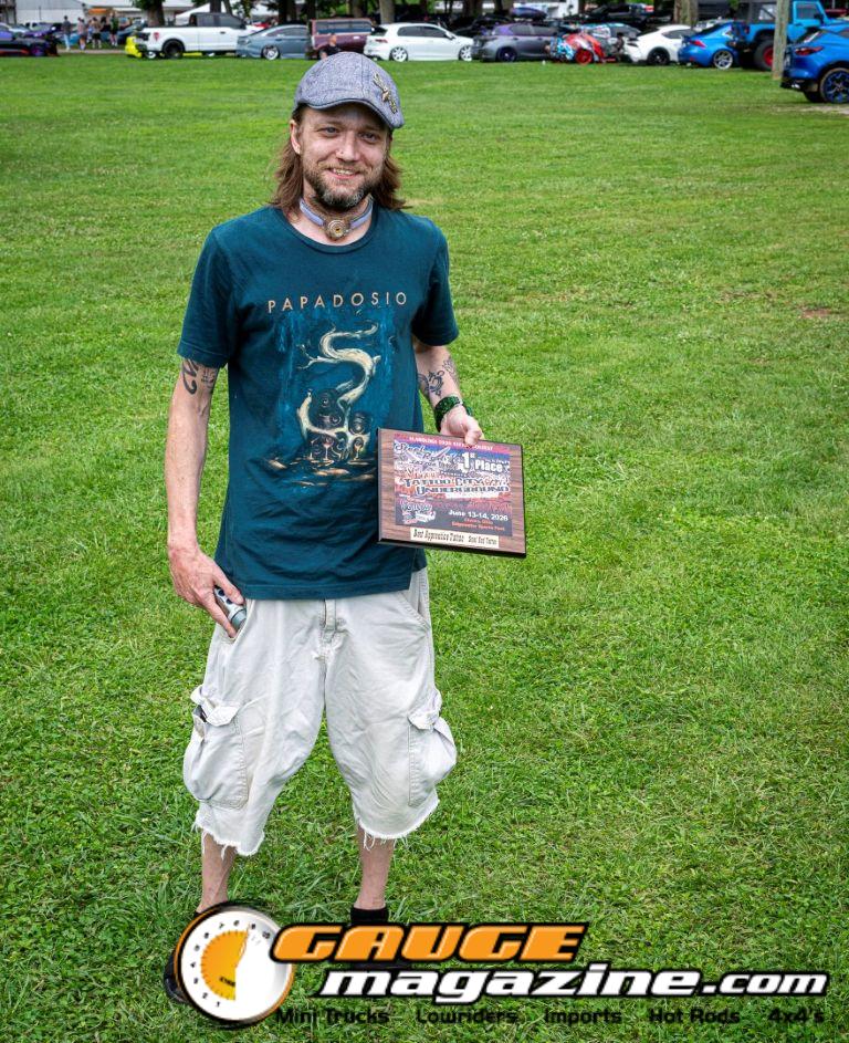 Contestants showing tattoo artwork during the Slamology 2026 Tattoo Contest on the Orion Car Audio Stage