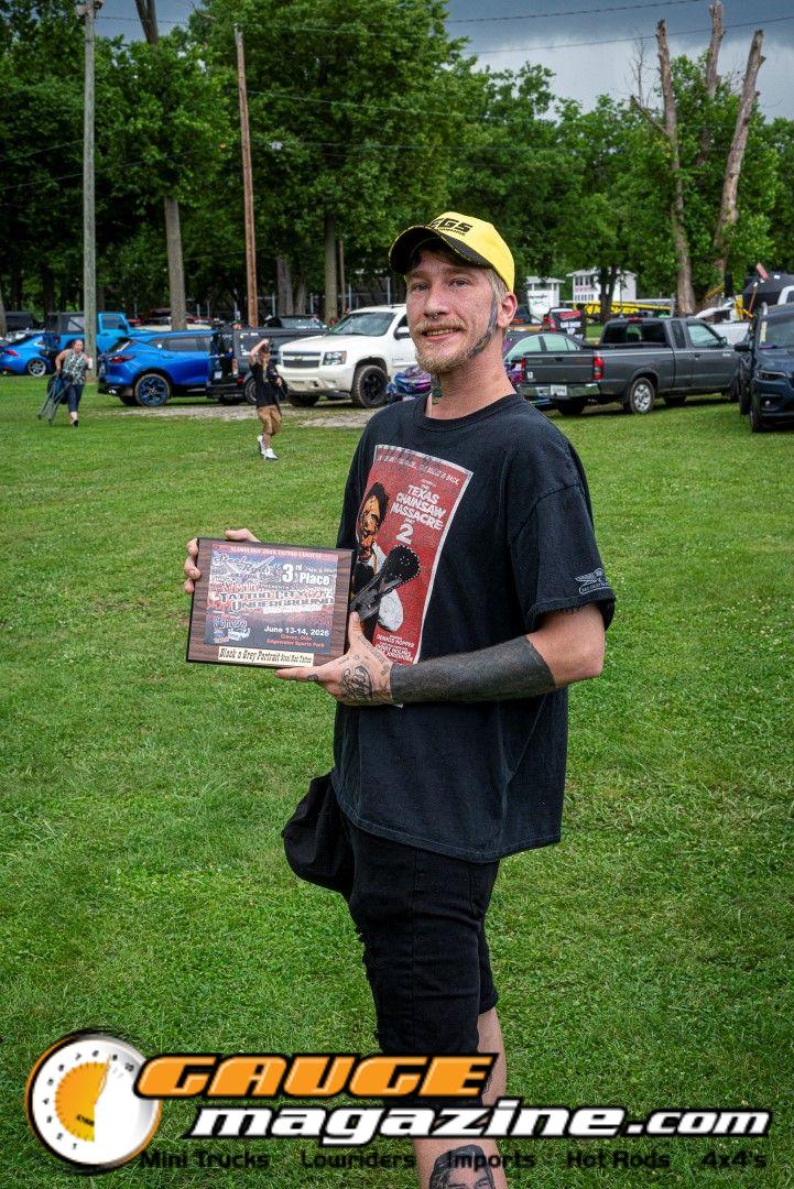 Contestants showing tattoo artwork during the Slamology 2026 Tattoo Contest on the Orion Car Audio Stage