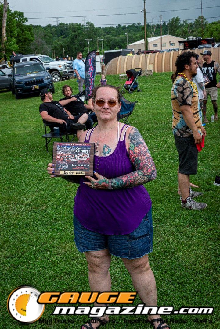 Contestants showing tattoo artwork during the Slamology 2026 Tattoo Contest on the Orion Car Audio Stage