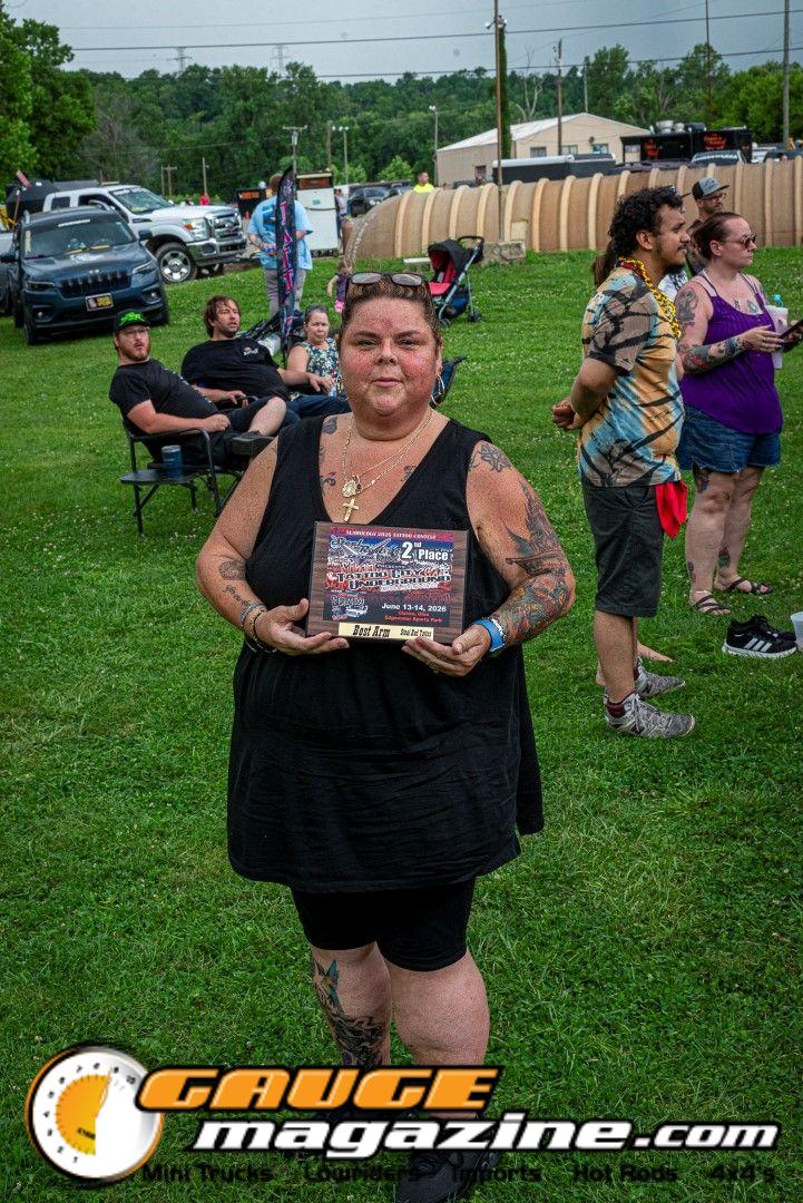 Contestants showing tattoo artwork during the Slamology 2026 Tattoo Contest on the Orion Car Audio Stage