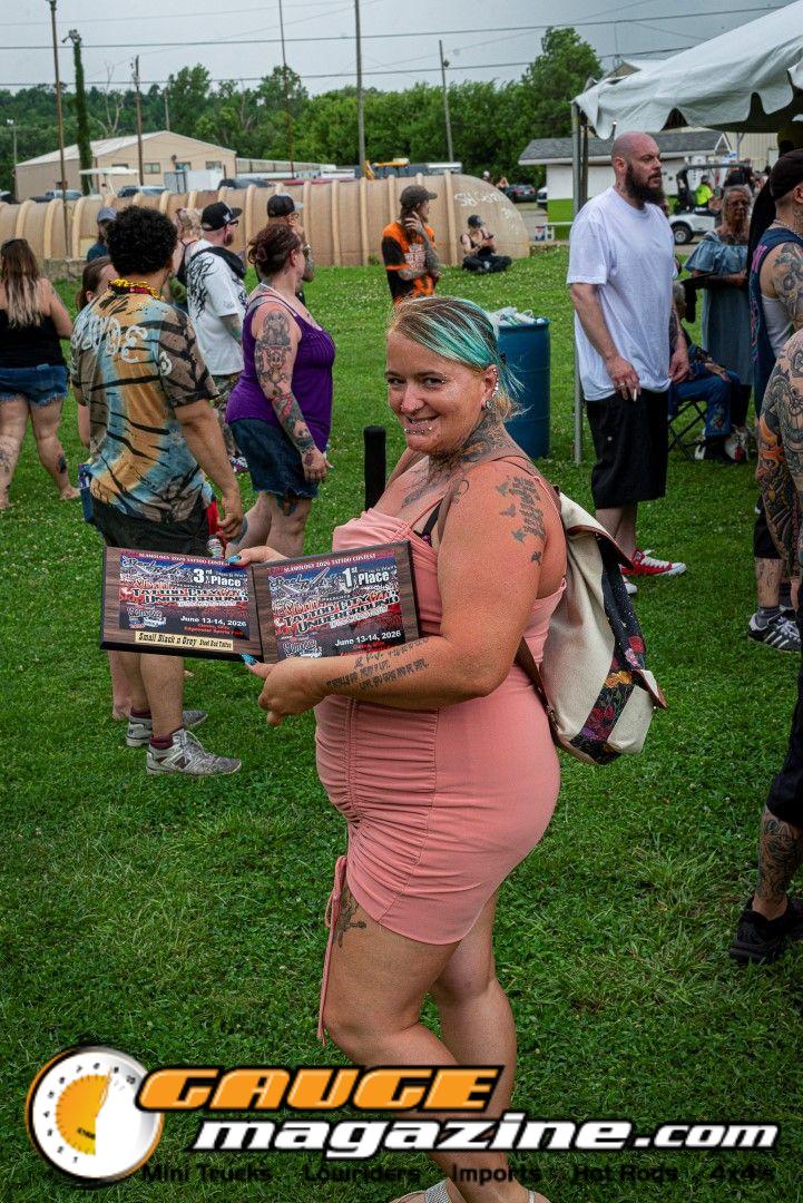 Contestants showing tattoo artwork during the Slamology 2026 Tattoo Contest on the Orion Car Audio Stage