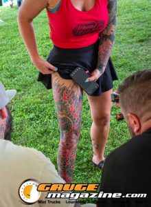 Contestants showing tattoo artwork during the Slamology 2026 Tattoo Contest on the Orion Car Audio Stage