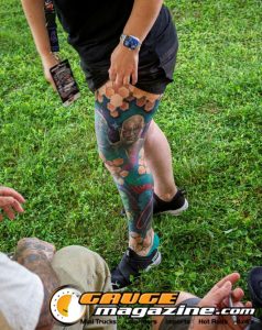 Contestants showing tattoo artwork during the Slamology 2026 Tattoo Contest on the Orion Car Audio Stage