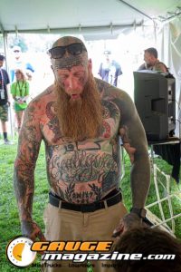Contestants showing tattoo artwork during the Slamology 2026 Tattoo Contest on the Orion Car Audio Stage