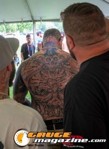 Contestants showing tattoo artwork during the Slamology 2026 Tattoo Contest on the Orion Car Audio Stage