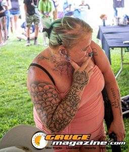 Contestants showing tattoo artwork during the Slamology 2026 Tattoo Contest on the Orion Car Audio Stage