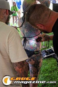 Contestants showing tattoo artwork during the Slamology 2026 Tattoo Contest on the Orion Car Audio Stage