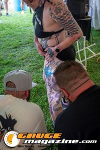 Contestants showing tattoo artwork during the Slamology 2026 Tattoo Contest on the Orion Car Audio Stage