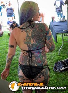 Contestants showing tattoo artwork during the Slamology 2026 Tattoo Contest on the Orion Car Audio Stage