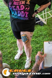 Contestants showing tattoo artwork during the Slamology 2026 Tattoo Contest on the Orion Car Audio Stage
