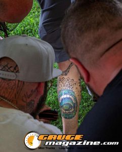 Contestants showing tattoo artwork during the Slamology 2026 Tattoo Contest on the Orion Car Audio Stage