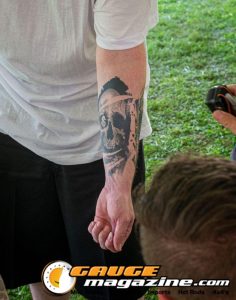 Contestants showing tattoo artwork during the Slamology 2026 Tattoo Contest on the Orion Car Audio Stage