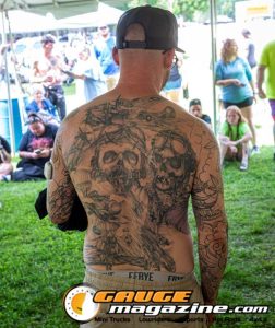 Contestants showing tattoo artwork during the Slamology 2026 Tattoo Contest on the Orion Car Audio Stage