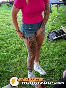 Contestants showing tattoo artwork during the Slamology 2026 Tattoo Contest on the Orion Car Audio Stage
