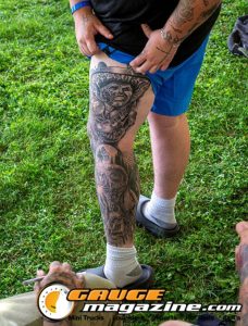 Contestants showing tattoo artwork during the Slamology 2026 Tattoo Contest on the Orion Car Audio Stage