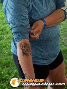 Contestants showing tattoo artwork during the Slamology 2026 Tattoo Contest on the Orion Car Audio Stage