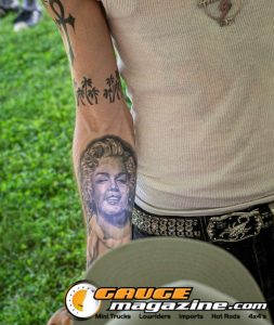 Contestants showing tattoo artwork during the Slamology 2026 Tattoo Contest on the Orion Car Audio Stage