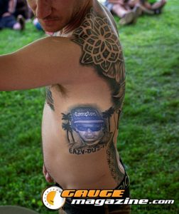 Contestants showing tattoo artwork during the Slamology 2026 Tattoo Contest on the Orion Car Audio Stage