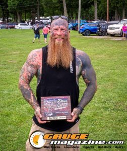 Contestants showing tattoo artwork during the Slamology 2026 Tattoo Contest on the Orion Car Audio Stage