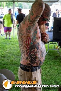 Contestants showing tattoo artwork during the Slamology 2026 Tattoo Contest on the Orion Car Audio Stage