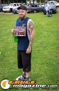 Contestants showing tattoo artwork during the Slamology 2026 Tattoo Contest on the Orion Car Audio Stage