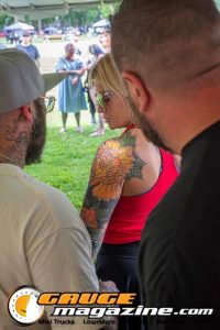 Contestants showing tattoo artwork during the Slamology 2026 Tattoo Contest on the Orion Car Audio Stage