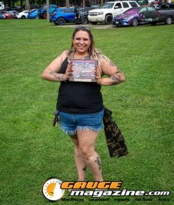Contestants showing tattoo artwork during the Slamology 2026 Tattoo Contest on the Orion Car Audio Stage