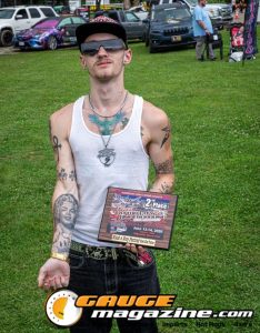 Contestants showing tattoo artwork during the Slamology 2026 Tattoo Contest on the Orion Car Audio Stage