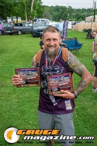 Contestants showing tattoo artwork during the Slamology 2026 Tattoo Contest on the Orion Car Audio Stage
