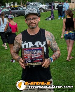 Contestants showing tattoo artwork during the Slamology 2026 Tattoo Contest on the Orion Car Audio Stage