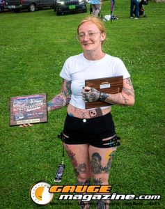 Contestants showing tattoo artwork during the Slamology 2026 Tattoo Contest on the Orion Car Audio Stage