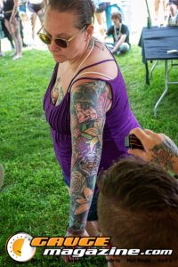 Contestants showing tattoo artwork during the Slamology 2026 Tattoo Contest on the Orion Car Audio Stage