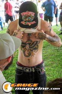 Contestants showing tattoo artwork during the Slamology 2026 Tattoo Contest on the Orion Car Audio Stage